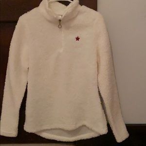 A fuzzy Sherpa quarter  zip sweater